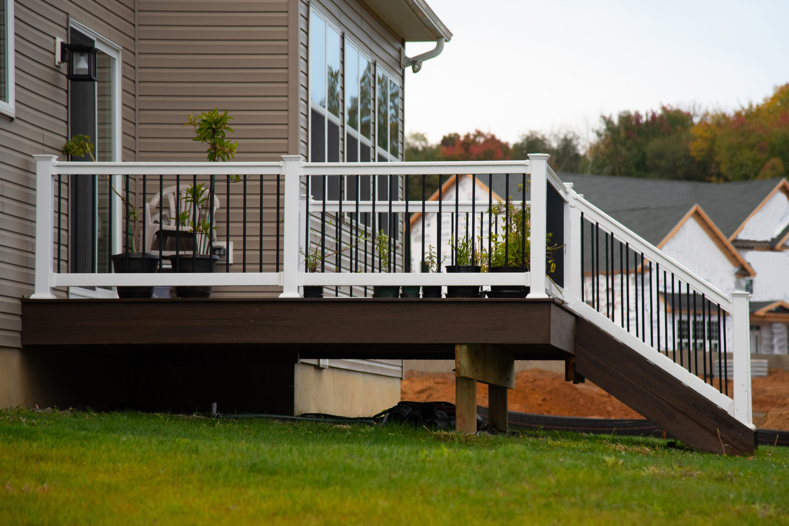 White veranda and railing posts porch wall new deck
